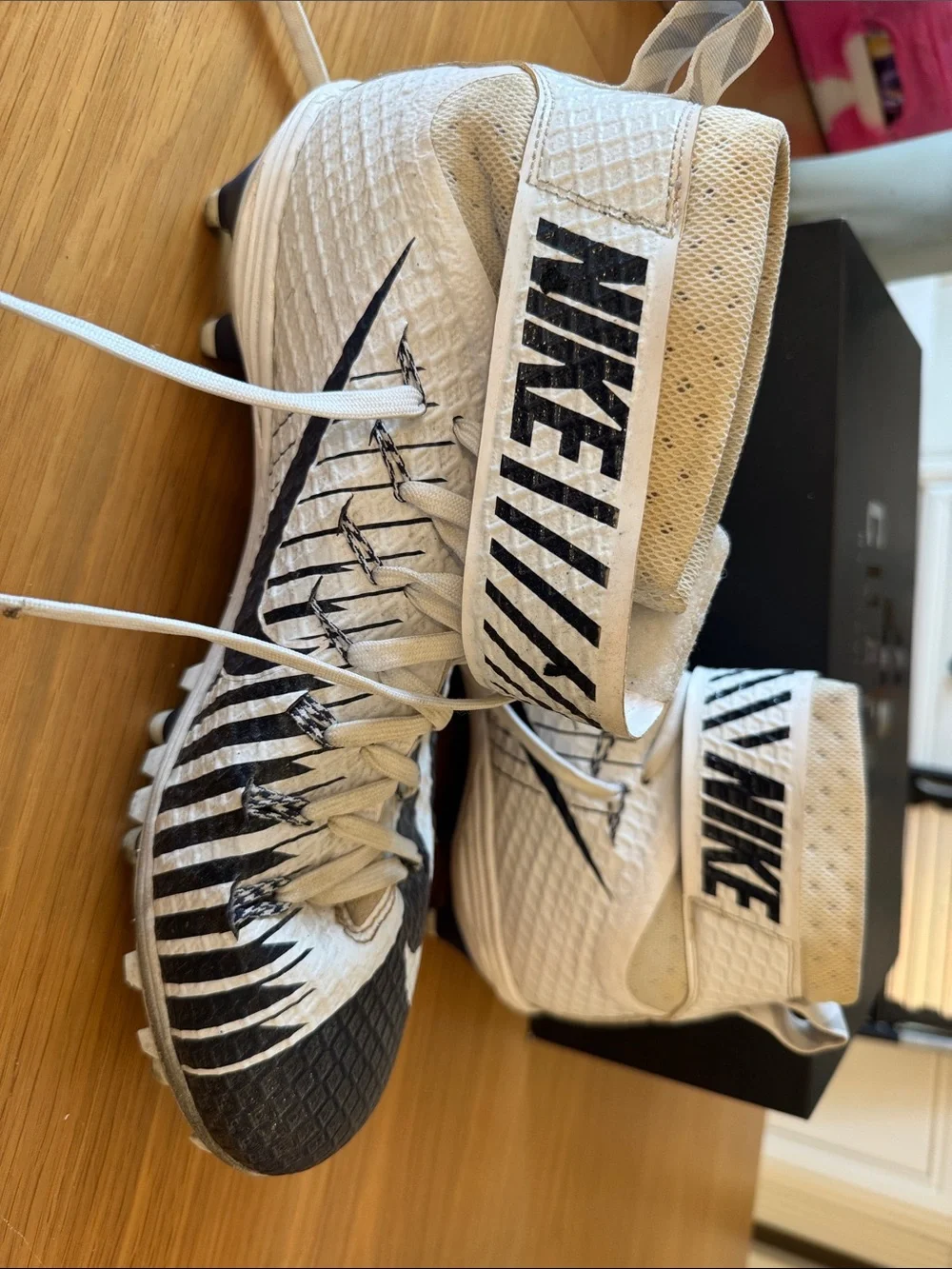 Nike White and Black High-Top Cleats with Graphic Stripes